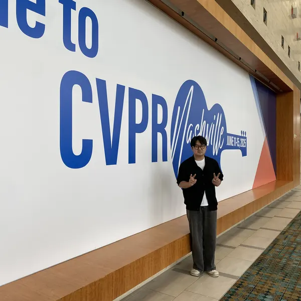 Jeongwan On in front of the Welcome to CVPR Nashville wall